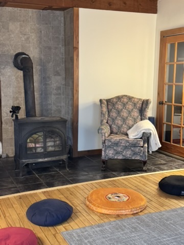 Cozy stone fireplace in the main house